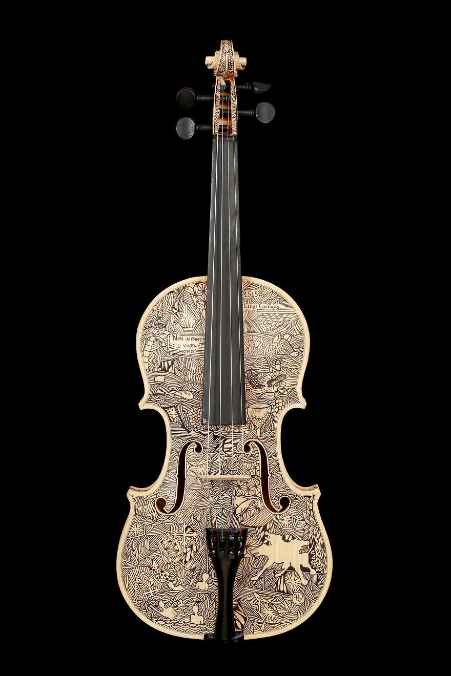 艺术家在小提琴上绘图 制造精美乐器